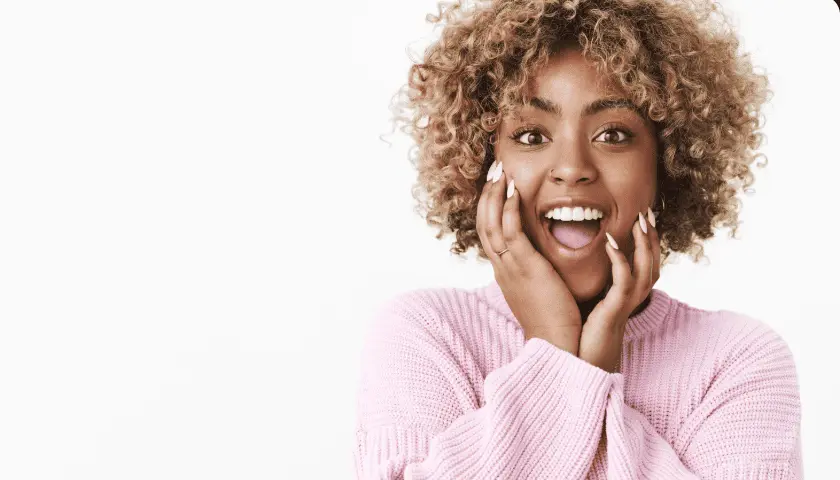 Bright smiling woman with beautiful teeth, representing the best dental clinic in Nairobi CBD.